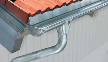 The gutter surrounds the edges of sloping rooftops The gutter surrounds the edges of sloping rooftops