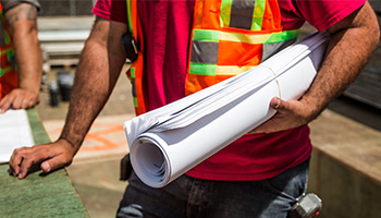 Reflective gear increases visibility of workers on a construction site Reflective gear increases visibility of workers on a construction site